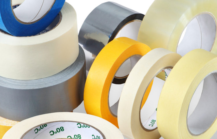 Several rolls of adhesive tapes different colors, sizes, purp